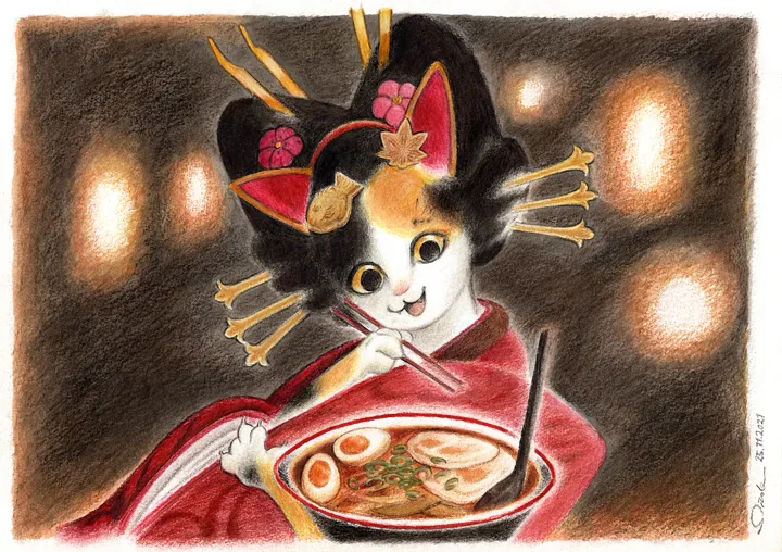 Calico cat in a kimono seated before a bowl of ramen in a Japanese restaurant.